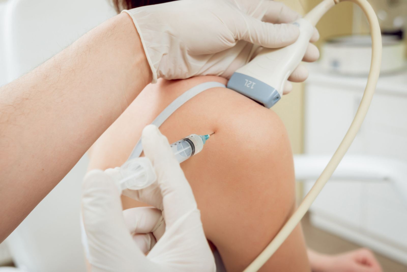 Clinician performing a diagnostic MSK ultrasound scan